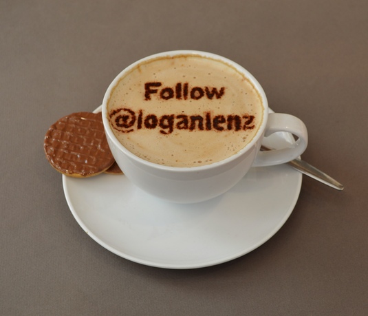 write a short message in the froth of a cup of cappuccino coffee, NOT photoshop 